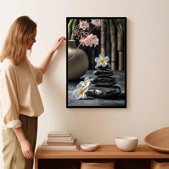A harmonious black stone stack paired with white and pink flowers bamboo and ceramic vases creates a tranquil Zen decor for minimalist homes and mindful spaces 12x18in Metal blackFramed