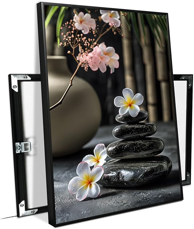 A harmonious black stone stack paired with white and pink flowers bamboo and ceramic vases creates a tranquil Zen decor for minimalist homes and mindful spaces 12x18in Metal blackFramed